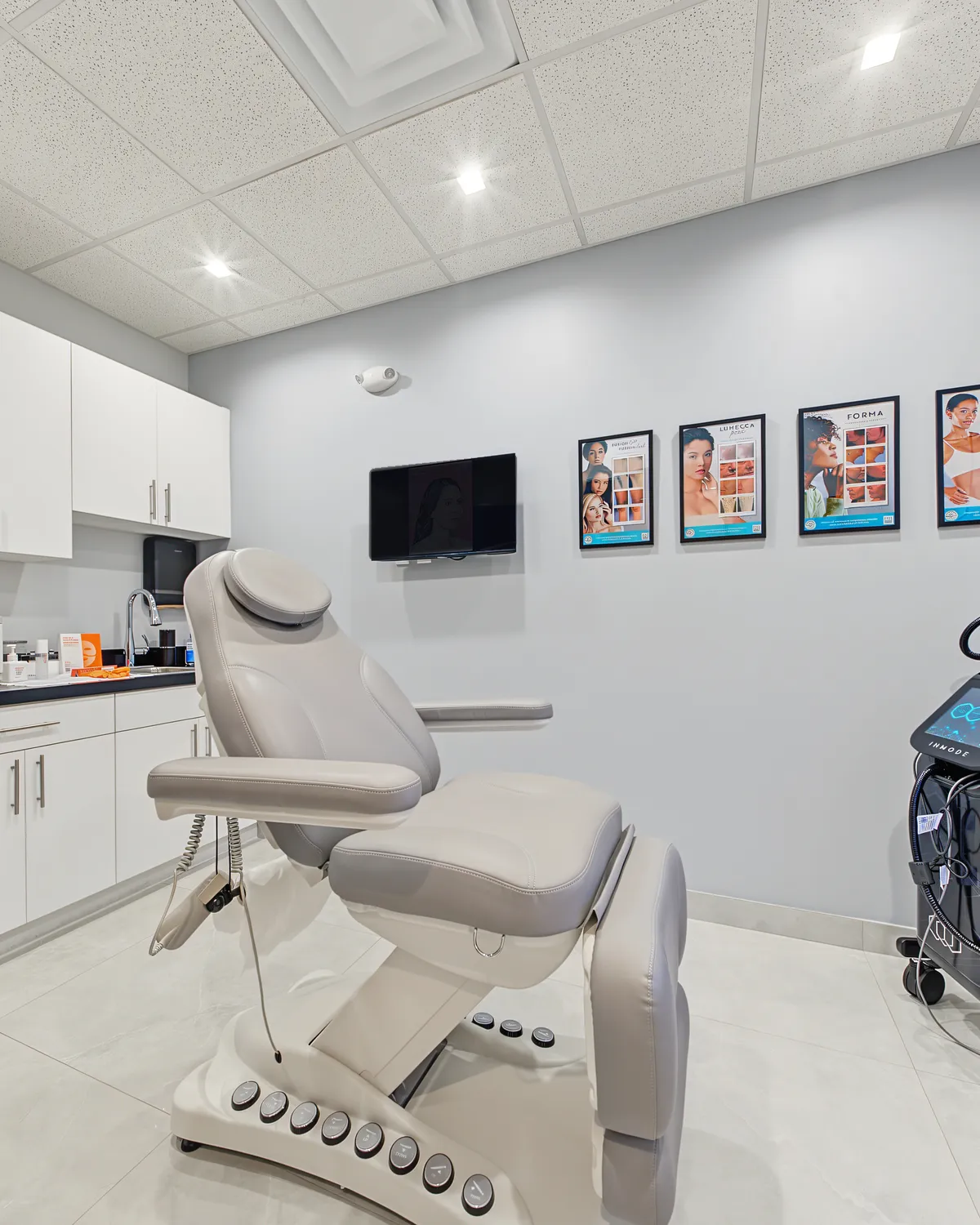 A bright treatment room with a reclining treatment chair