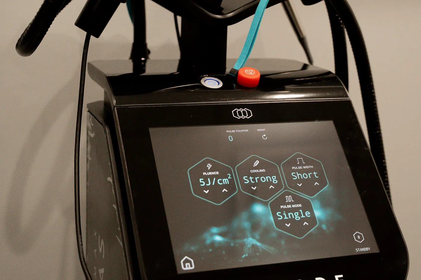 The InMode laser and its touchscreen in a treatment room at AWE