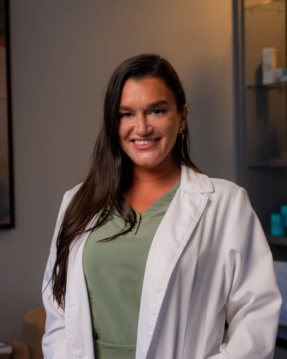 Lorena Morales in a white coat in the AWE lobby